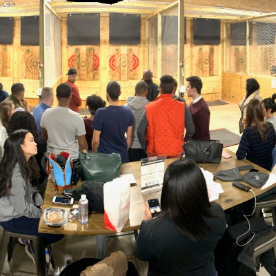 group of people at axe throwing