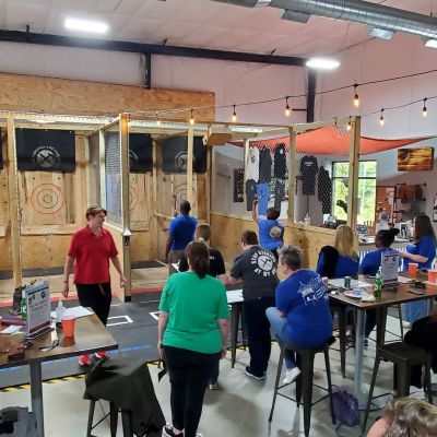 a group of people standing in front of a store