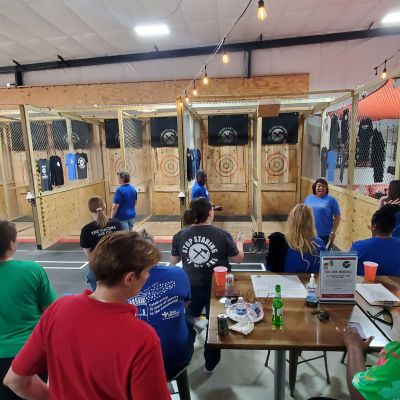 a group of people sitting at a table in a restaurant