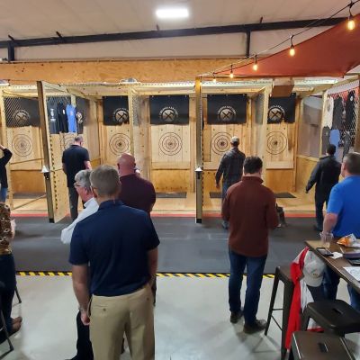 a group of people standing in front of a store