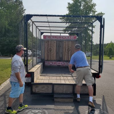 a group of people riding on the back of a truck