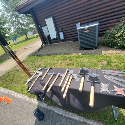 a couple of lawn chairs sitting on top of a wooden bench
