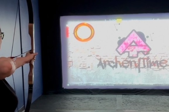 a person standing in front of a screen